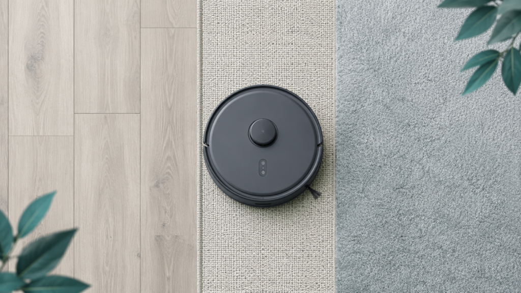 Illustration of a generic robot vacuum moving across hard floor, rug, and carpet surfaces